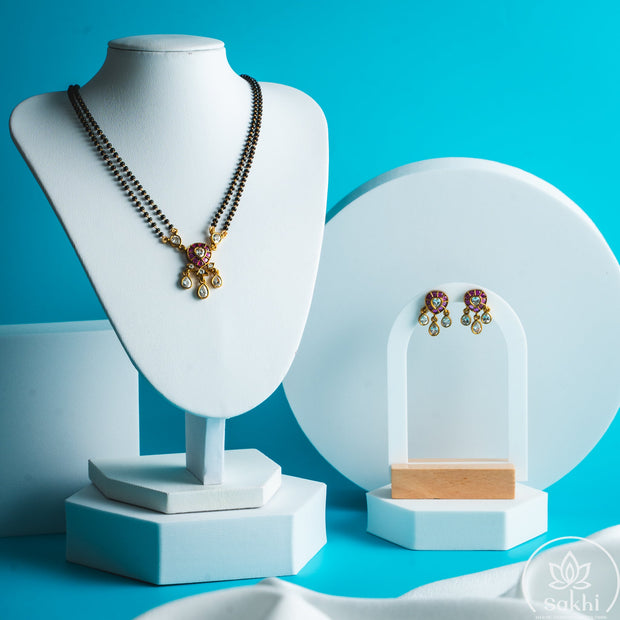 Regal Kundan Drop Black Beads Necklace Set